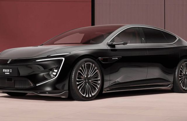 2025 Avatr 12 with sleek design, alloy wheels, displayed in modern indoor setting.