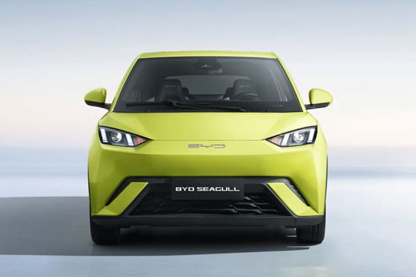 Front view of a bright yellow BYD Seagull compact car. Features sharp headlights, "BYD" branding, and "BYD SEAGULL" badging, set against a soft, light background, showcasing its sleek, modern front-end design.