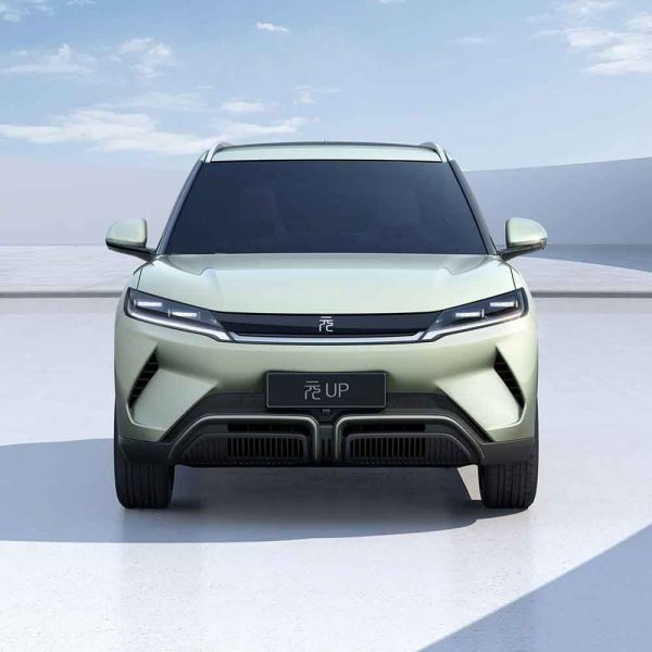 BYD Yuan UP electric SUV: Light green exterior, presented from a frontal angle against a minimalist background.