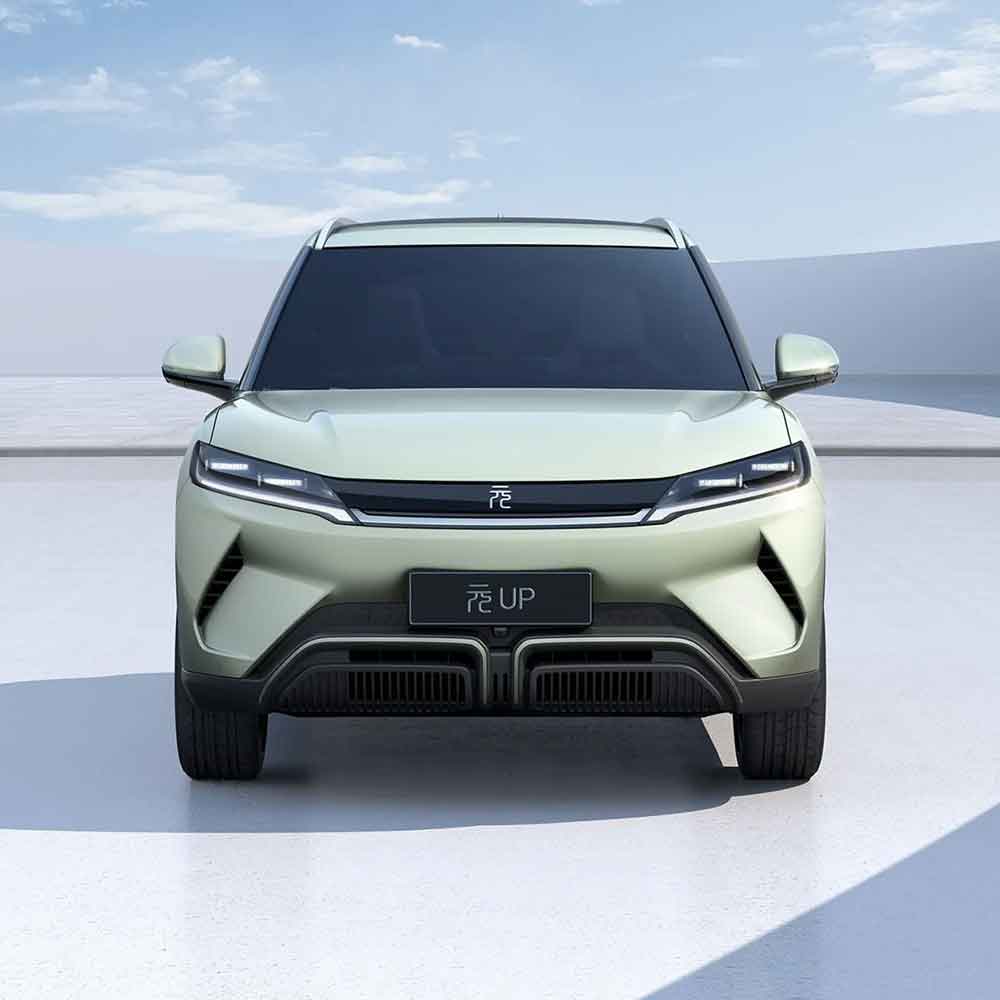 BYD Yuan UP electric SUV: Light green exterior, presented from a frontal angle against a minimalist background.