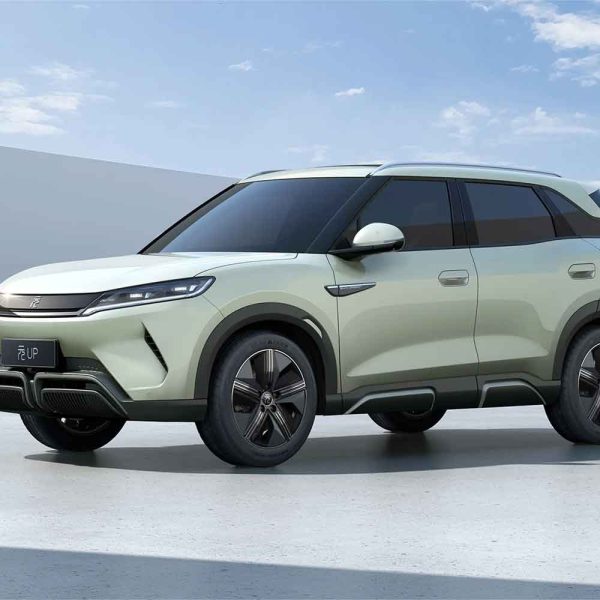 Side view of a light green BYD Yuan UP SUV, showcasing its sleek design and modern features.
