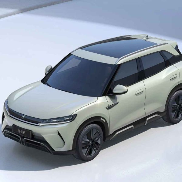 Top - down view of a light green BYD Yuan UP SUV, showcasing its sleek design and panoramic sunroof.