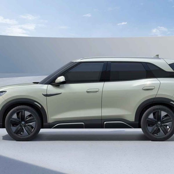 Top - down view of a light green BYD Yuan UP SUV, showcasing its sleek design and panoramic sunroof.
