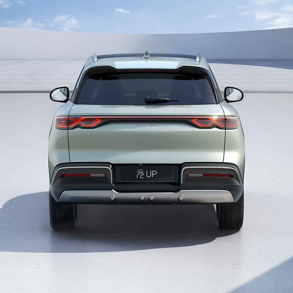 Rear - view of a light green BYD Yuan UP SUV, showcasing its modern taillights and sleek design.