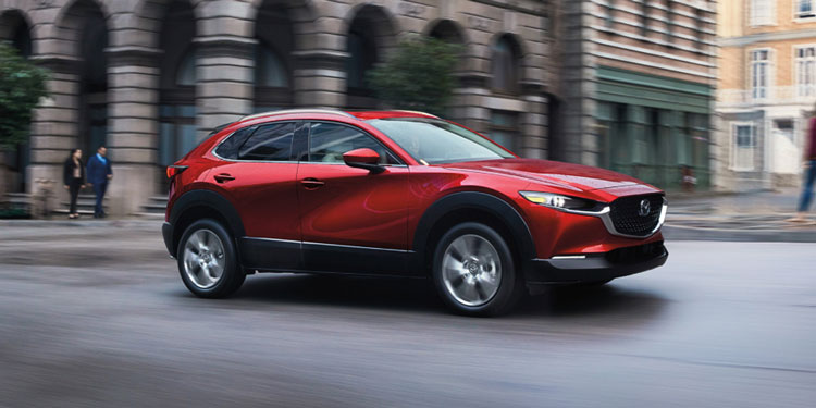 Side view of a 2025 Mazda CX-30 while driving