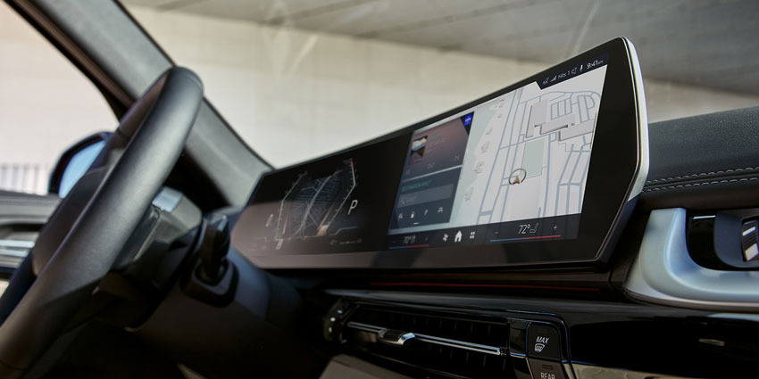 2025 BMW X1 infotainment screen: navigation map, vehicle view, controls—modern dashboard tech detail.