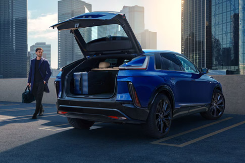 Blue 2025 Cadillac LYRIQ with the trunk open