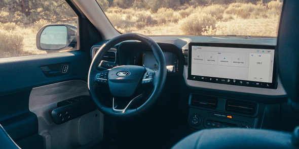 Front interior of steering wheel and center display on a 2026 Ford Maverick pickup
