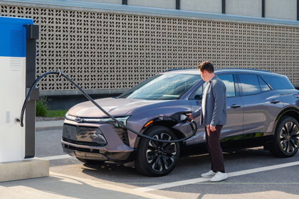 Side View of a Man Charging a 2025 Chevrolet Blazer EV
