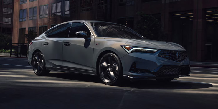 2026 Acura Integra Front Three-Quarter driving in Urban Gray Pearl