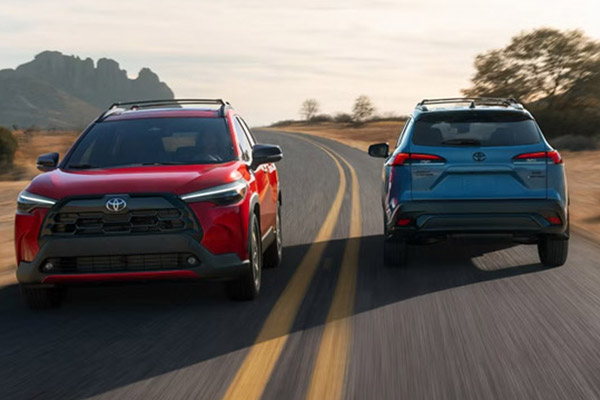 2026 Toyota Corolla Cross XLE models in Soul Red Crystal and Cavalry Blue