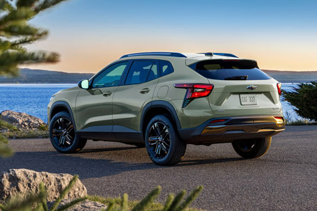 Driver's Side profile View of a 2026 Chevrolet Trax Parked Facing a Lake