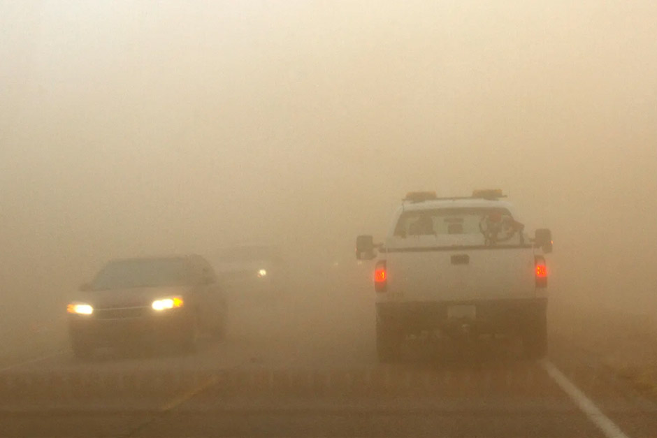 Cars driving in a sandstorm