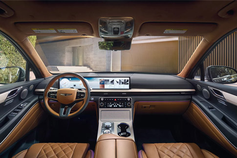 Front dashboard interior shot of 2026 Genesis GV80 with tan seats