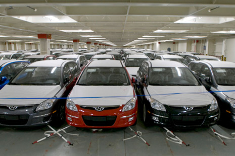 Imported new cars parked indoors
