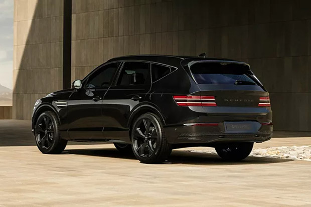 Rear three-quarter view of a black 2026 Genesis GV80