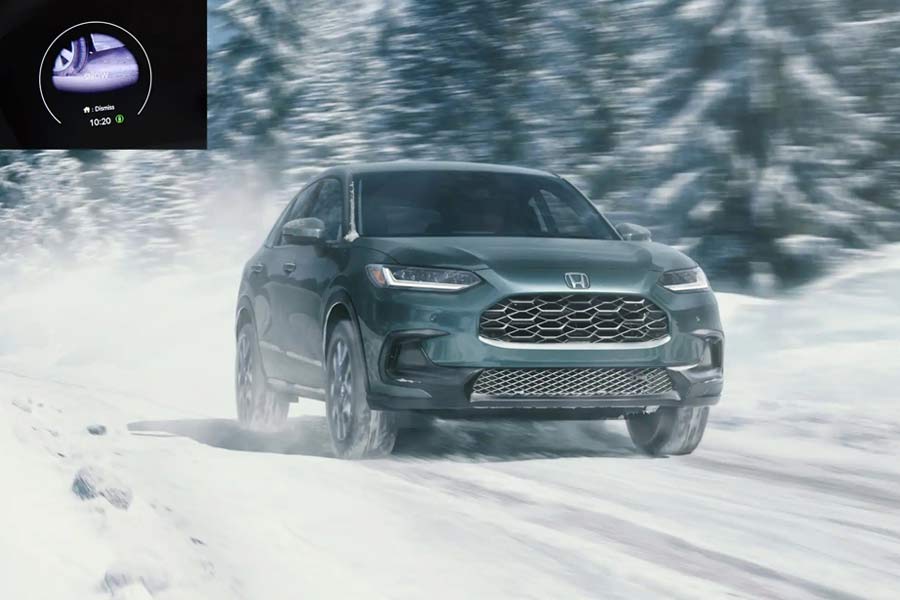 2027 Honda HR-V EX-L driving on a snowy road front view