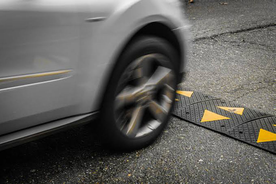 Car crossing a speed bump at high speed
