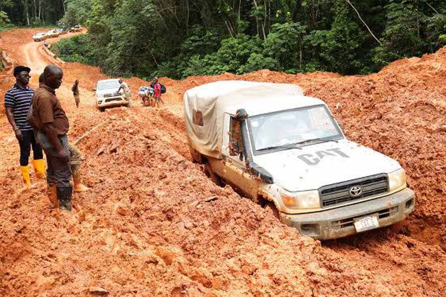 SUVs driving in Cambodia during the rainy season